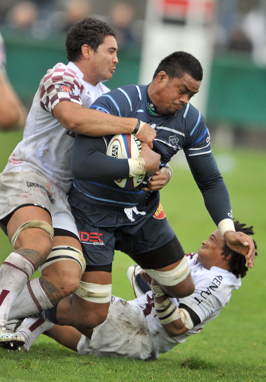 Castres' No.8 Joe Tekori is floored by the Bordeaux defence