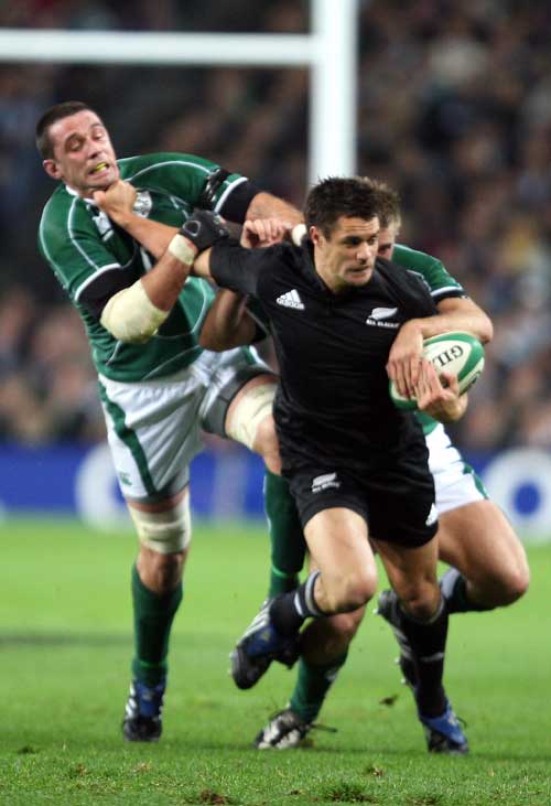 All Black Dan Carter vies with the Irish defence