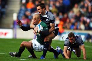Thom Evans and Chris Paterson (R) of Scotland stop Conrad Jantjes of South Africa during the rugby match between Scotland and South Africa at Murrayfield on November 15, 2008 in Edinburgh, Scotland. 