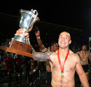 New Zealand's DJ Forbes celebrates with the George Sevens trophy