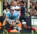 Perpignan fly-half James Hook is tackled by Timoci Matanavou