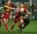 The Scarlets' Gareth Davies stretches the Northampton defence