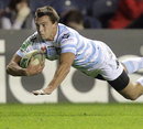 Racing Metro's Juan Imhoff dives in to score a try
