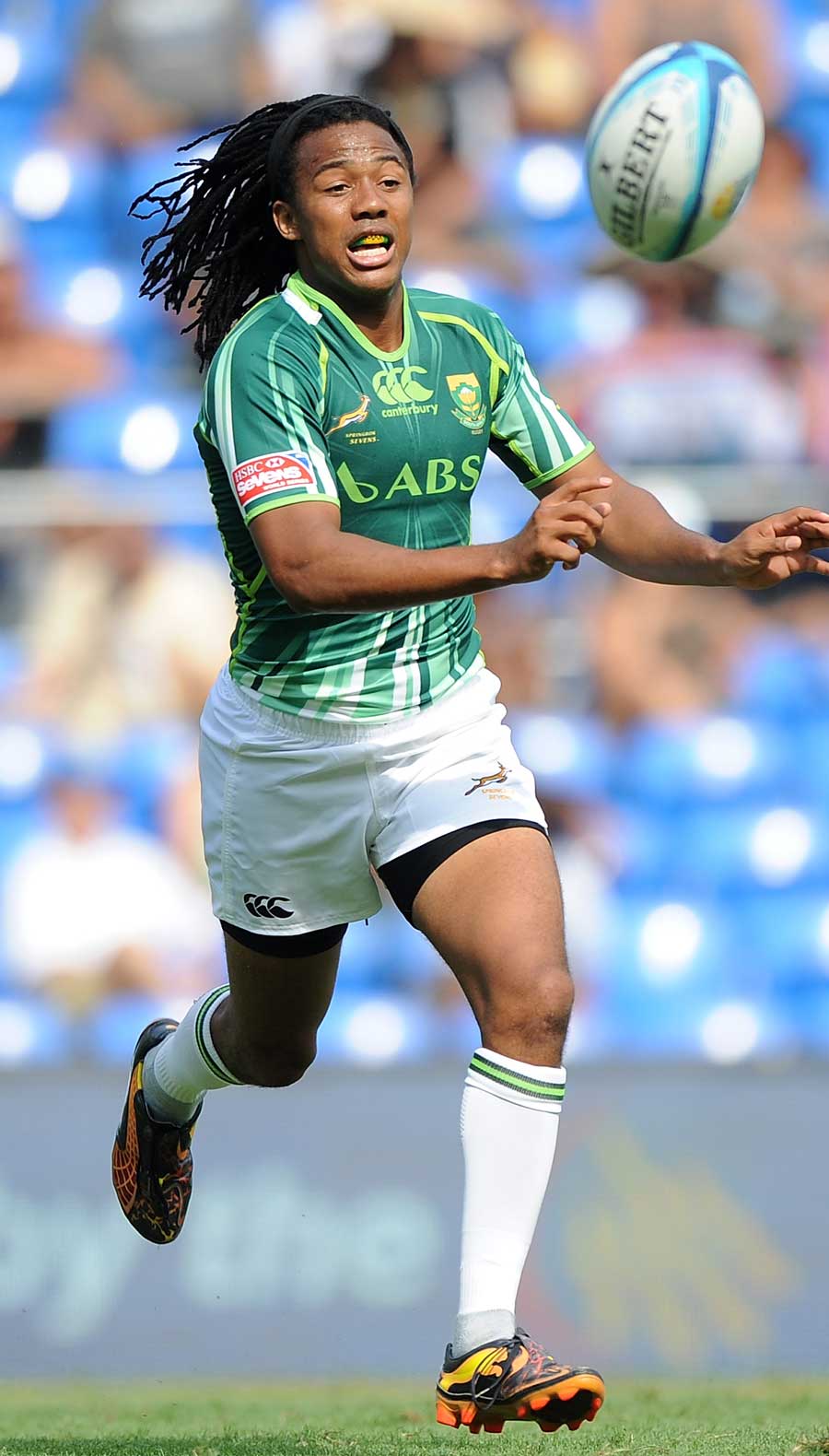 South Africa's Cecil Afrika shifts the ball