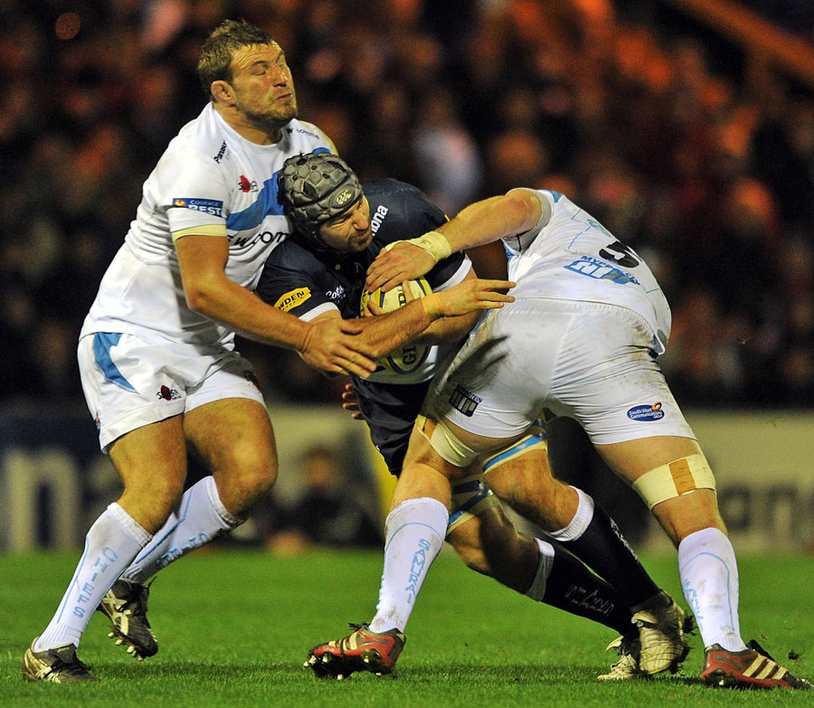 Sale's Fraser McKenzie is wrapped up by the Exeter defence