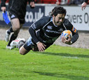 Glasgow Warrior's Troy Nathan scores a try
