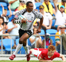 Fiji' Setefano Cakau races clear against Wales in the Cup quarter final
