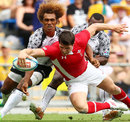 Wales' Richard Smith lunges for the try line against Fiji