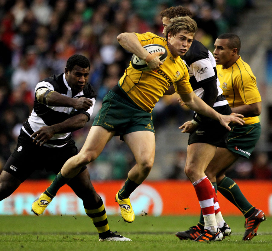 Wallabies fly-half James O'Connor escapes the clutches of Seru Rabeni