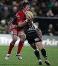 Saracens No.8 Ernst Joubert is tackled by Ryan Lamb