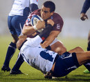 Bordeaux's Thierry Brana is hauled down by Jalil Narjissi