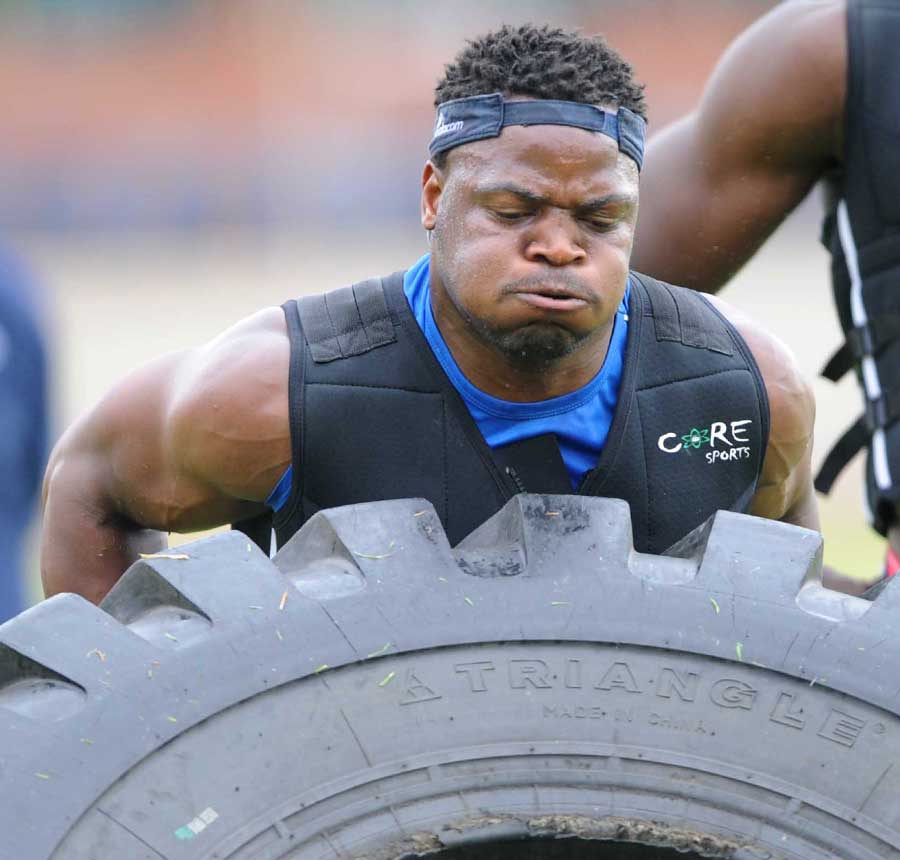 Chiliboy Ralepelle of the Bulls tries to shift a tyre during a gruelling pre-season session