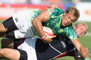 South Africa's Chase Minnaar is tackled by the United States' Matt Hawkins 