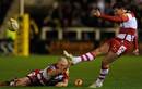 Gloucester's Freddie Burns goes for the posts with the aid of Scott Lawson