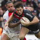 Toulouse's Yannick Jauzion tries to force his way through the Toulon defence