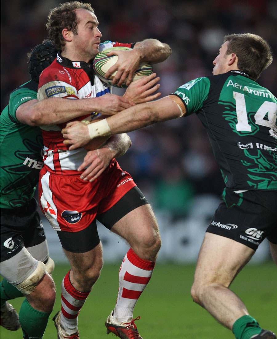 Gloucester wing James Simpson-Daniel is wrapped up by two defenders