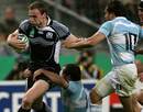 Scotland's Chris Paterson tries to break away from the Pumas defence