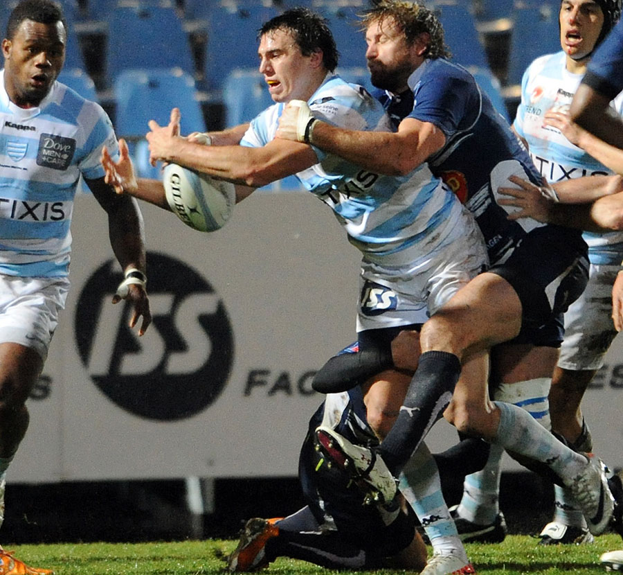 Racing Metro's Juan Imhoff struggles to hold on to the ball
