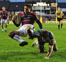 Sale's Rob Miller is tackled by Leicester's Horacio Agulla