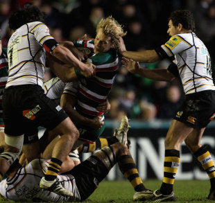 Leicester's Billy Twelvetrees is wrapped up by the Wasps defence, Leicester Tigers v London Wasps, Aviva Premiership, Welford Road, Leicester, England, January 7, 2012