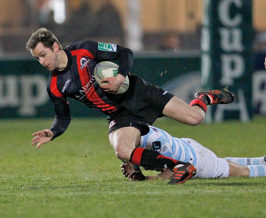 Edinburgh's Chris Paterson is felled by the Racing Metro defence