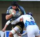 Bath's Dave Attwood puts in a hit on Montpellier's Mickael De Marco