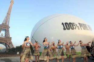 New Zealand Mauri dancers perform in front of a giant pavillion shaped like a rugby ball and dedicated to his home country near the Eiffel Tower in Paris on October 5, 2007.