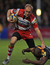 Gloucester's Olly Morgan is tackled by Worcester's Miles Benjamin