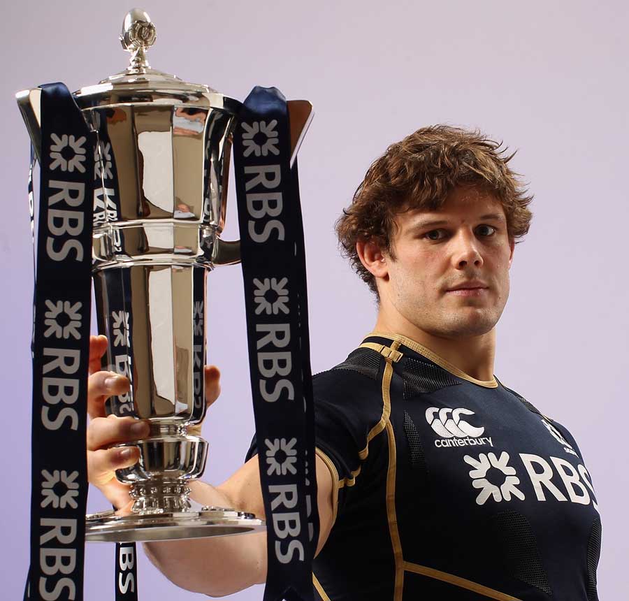 Scotland's Ross Ford holds aloft the Six Nations trophy