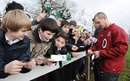England boss Stuart Lancaster signs some autographs