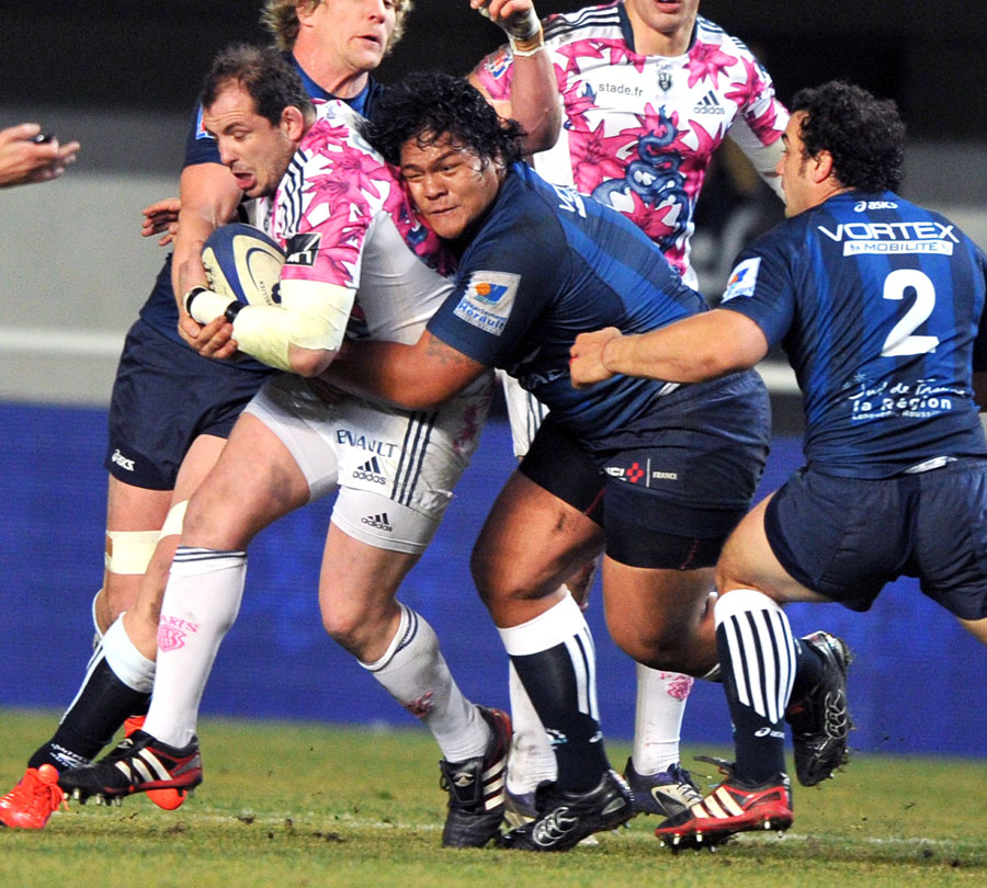 Stade Francais prop David Attoub attempts to protect the ball