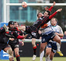 Lyon fullback Romain Loursac is sent flying as he attempts to claim a high ball