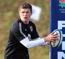 England's Owen Farrell looks to shift the ball during training