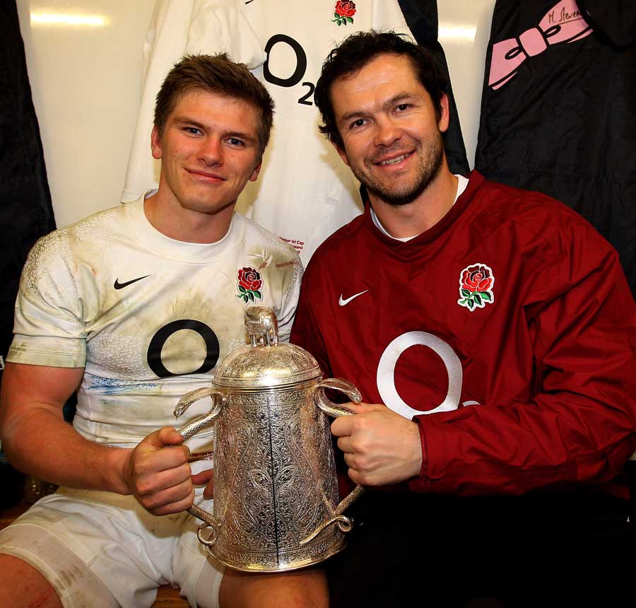 Owen Farrell grasps the Calcutta Cup along with father Andy