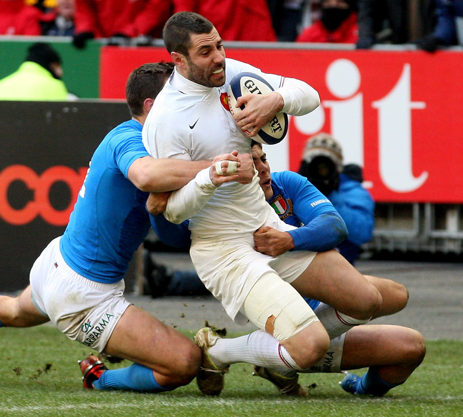 France's Julien Malzieu forces his way over for a try