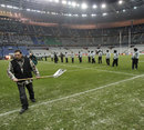 Ground staff prepare the Stade de France pitch