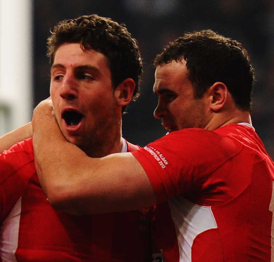 Wales' Alex Cuthbert is congratulated on his try