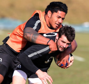 Manu Tuilagi pounces on Ben Foden during England training, Pennyhill Park Hotel, Bagshot, England, February 15, 2012