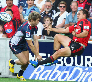 The Rebels' James O'Connor throws the Crusaders' Israel Dagg into touch, Melbourne Rebels v Crusaders,  AAMI Park, Melbourne, Australia, February 18, 2012