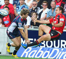 The Rebels' James O'Connor throws the Crusaders' Israel Dagg into touch