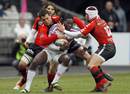 Stade Francais' Paul Sackey is halted by the Toulon defence