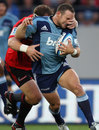 The Blues' Alby Mathewson is snagged by the Crusaders' defence