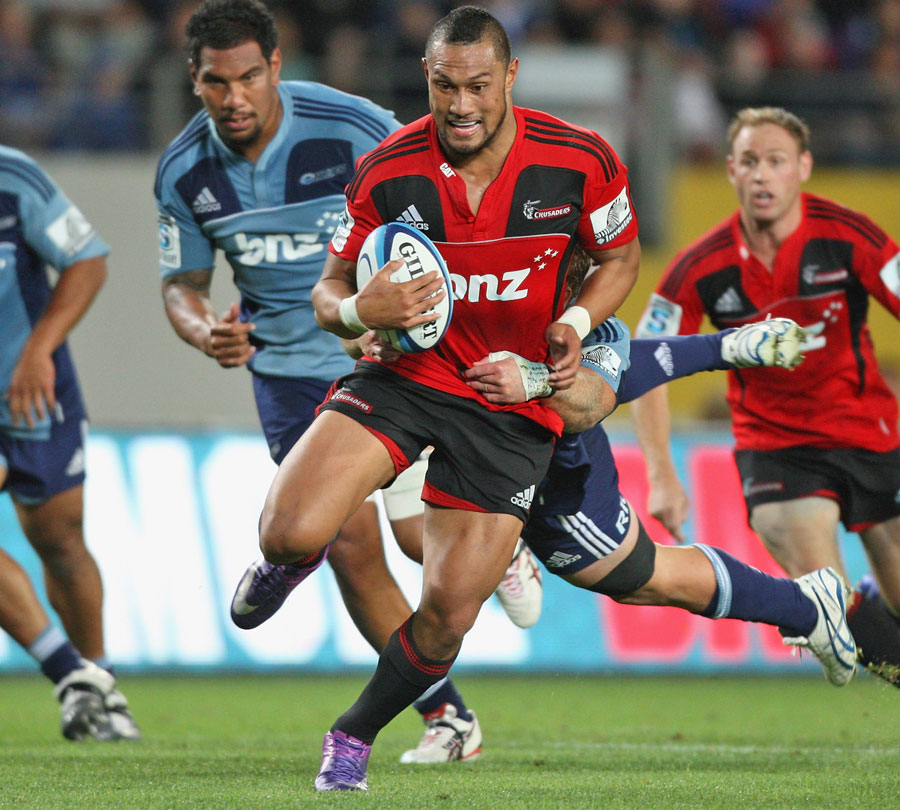The Crusaders' Robbie Fruean stretches the Blues' defence