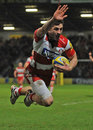 Gloucester's Jonny May salutes the crowd before scoring