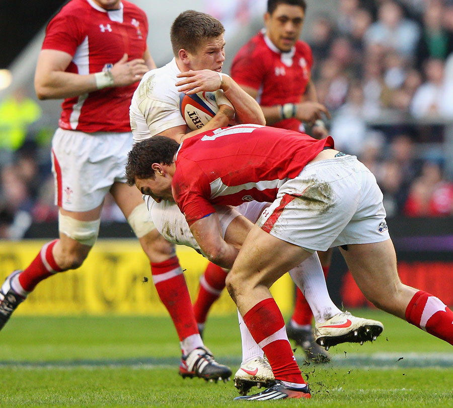 Wales' George North tackles England's Owen Farrell