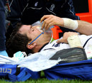 Scotland's Rory Lamont is stretchered from the field