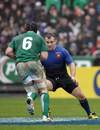 Ireland flanker Stephen Ferris takes on Nicolas Mas