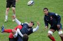 France wing Vincent Clerc is smashed by a team-mate
