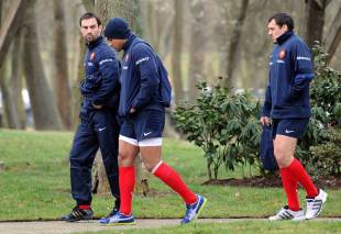 France scrum-half Morgan Parra walks to training with Wesley Fofana and Lionel Beauxis