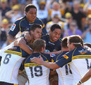 The Brumbies celebrate their late win over the Cheetahs
